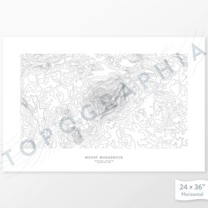 May include: A black and white topographic map print of Mount Monadnock, a mountain in New Hampshire. The print is 24 inches by 36 inches and is horizontal.