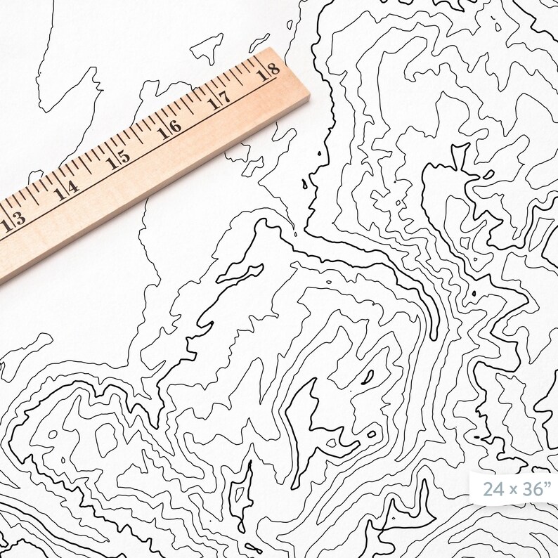 May include: A black and white topographic map print with contour lines. The print is 24 inches by 36 inches. A wooden ruler is placed on the top of the print.