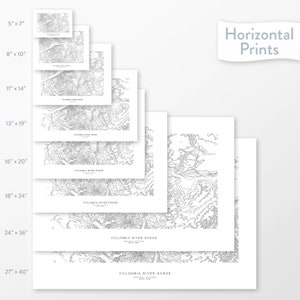 May include: A set of eight different sized prints of a black and white topographic map of the Columbia River Gorge. The prints are arranged in a staggered pattern, with the largest print at the bottom and the smallest print at the top. The prints are all on white paper and have a white border.