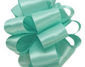 May include: A spool of light turquoise satin ribbon. The ribbon is smooth and shiny.