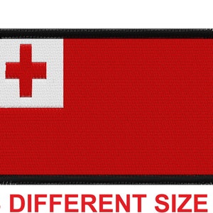 May include: An embroidered patch featuring the flag of Tonga. The patch is red with a white cross and has a black border. The text "3 DIFFERENT SIZE" is at the bottom.