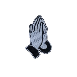 Peut inclure: Patch brodé noir et blanc de deux mains jointes en prière.