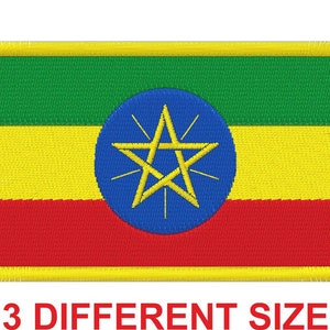 May include: An embroidered patch of the Ethiopian flag. The flag is green, yellow, and red with a blue circle in the center containing a gold five-pointed star.
