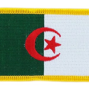 May include: A green, white, and red embroidered patch with a crescent moon and star. The patch has a yellow border.