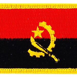May include: A red and black embroidered patch with a yellow star and a yellow sickle and hammer inside a yellow crescent moon.