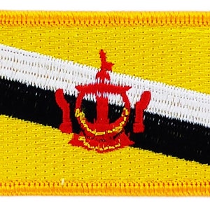 May include: An embroidered patch featuring the flag of Brunei. The flag is yellow with a black and white diagonal stripe and a red emblem in the center.