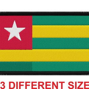 May include: Embroidered patch featuring the flag of Togo. The flag is red, yellow, and green with a white five-pointed star in the red section. The patch has a black border.