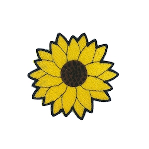 May include: A yellow embroidered sunflower patch with a brown centre. The sunflower is outlined in black.