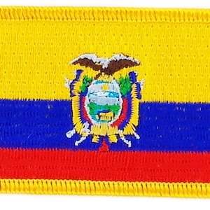 May include: A yellow, blue, and red embroidered patch with the coat of arms of Ecuador in the center. The coat of arms features a condor with outstretched wings, a shield with a white band, and a laurel wreath.