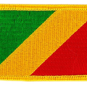 May include: Embroidered patch featuring the flag of the Republic of the Congo. The design includes a green triangle, a yellow diagonal stripe, and a red section. The patch has a yellow border.