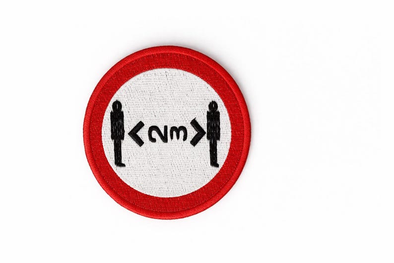 May include: Circular patch with a red border and a white centre. The patch shows black silhouettes of two people with an arrow and the text "<2m>" between them, indicating a social distancing guideline.