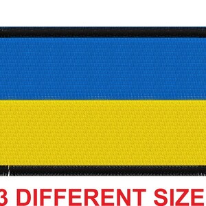 Puede incluir: Un parche bordado azul y amarillo con un borde negro. El parche presenta la bandera de Ucrania.