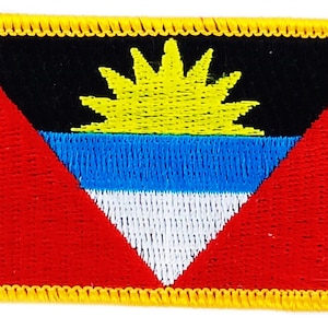 May include: An embroidered patch featuring the flag of Antigua and Barbuda. The flag is red, white, blue, and yellow with a black background and a yellow sun in the center.