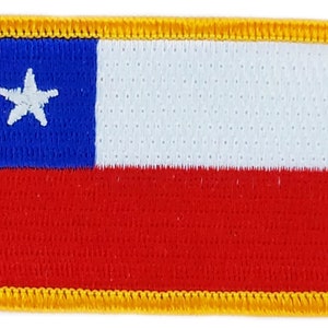 May include: A rectangular embroidered patch with a yellow border. The patch features the flag of Chile, with a blue field with a white star in the upper left corner, a white stripe in the middle, and a red stripe at the bottom.