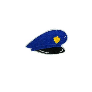 Può includere: Toppa ricamata blu e nera per cappello da poliziotto con un distintivo giallo.