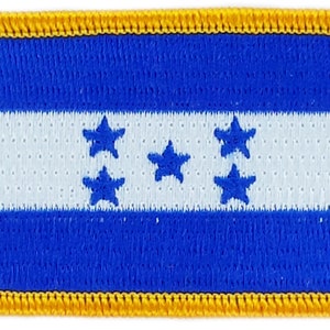 May include: A blue and white embroidered patch with a yellow border. The patch features the flag of Honduras, with five white stars on a white stripe.