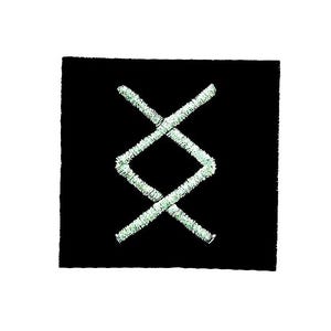 May include: A black square patch featuring a white, interwoven, diamond-shaped design. The design is made of a textured, possibly embroidered, material. The patch is isolated on a white background.