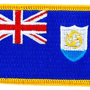 May include: An embroidered patch featuring the flag of the British Virgin Islands. The flag is blue with a white Union Jack in the upper left corner and the territory's coat of arms in the lower right corner. The patch has a yellow border.