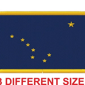 May include: A blue embroidered patch with a yellow border and a yellow star in the upper right corner. The patch features a constellation of eight yellow stars in the shape of the Big Dipper.