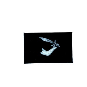 May include: Black fabric patch with a white embroidered image of a hand holding a sword.
