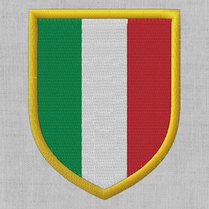 Può includere: Una toppa ricamata a forma di scudo con un design verde, bianco e rosso e un bordo dorato.