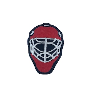 May include: Red and black hockey goalie mask patch with a white wire cage.