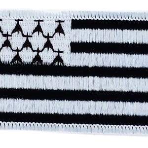 May include: Embroidered patch featuring the flag of Brittany, France. The design includes a white field with black horizontal stripes and a canton with black ermine spots. The patch has a white border.
