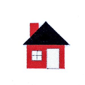 May include: A red house with a black roof, a white door, and a single window. The house is made of felt and is a simple design.
