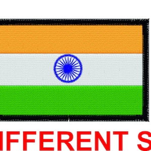 May include: An embroidered patch of the Indian flag. The flag is rectangular with three horizontal stripes: saffron, white, and green. The white stripe features a blue wheel with 24 spokes in the centre.