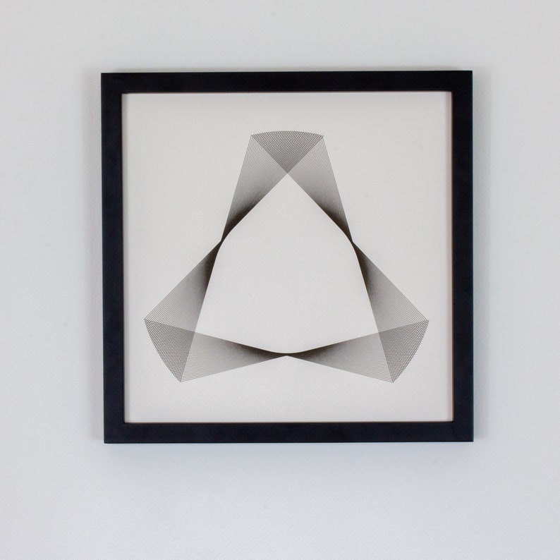 May include: A black framed print with a geometric design of a triangle made of thin black lines on a white background.