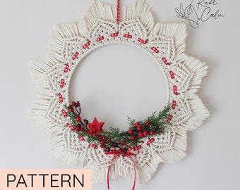 May include: A white macrame wreath with red ribbon and red berries. The wreath is in the shape of a star and has a fringe around the edge. The text "Knot Calm" is in the upper right corner of the image. The text "PATTERN" is in the lower left corner of the image.
