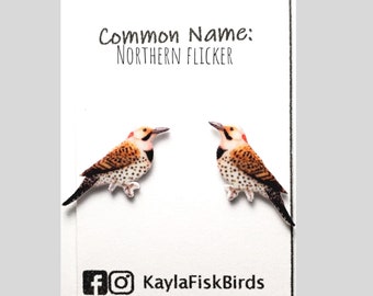 May include: A pair of earrings featuring a Northern Flicker bird design. The earrings are made of polymer clay and are painted in realistic colors. The earrings are a great way to show your love for birds.