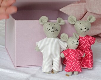 Cute mouse family in the box. A portable toy for a child.