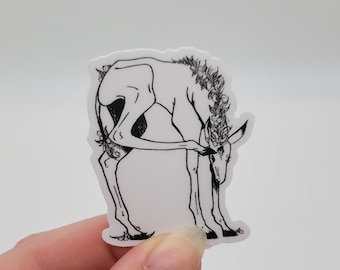 May include: Black and white line art sticker of a stylized deer with a floral crown, bending down to look at something.
