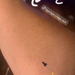 May include: Close-up of an arm with the word "After" in white script. A dropper dispenses a yellow liquid. Text reads "bye bye crepe skin" and "WOW!"