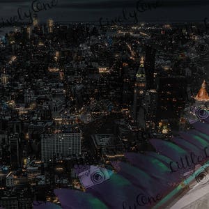 May include: An aerial view of a city at night, with many buildings lit up. The city is seen from a high vantage point, with a dark, textured surface in the foreground.