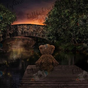 May include: A brown teddy bear sits on a wooden dock overlooking a dark, still pond. The pond is surrounded by trees and a stone bridge. The sky is a soft orange and purple.