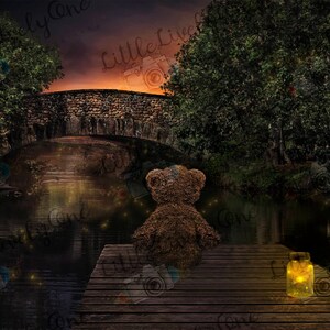 May include: A brown teddy bear sits on a wooden dock overlooking a dark, still pond. The pond is surrounded by trees and a stone bridge. A small jar with a glowing light sits on the dock next to the bear.