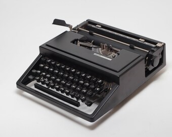 Olivetti Dora zwarte typemachine, vintage, handmatig, onderhouden