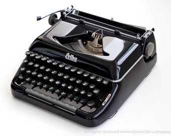 Erika Modell 10 schwarze Vintage-Schreibmaschine, professionell gewartet