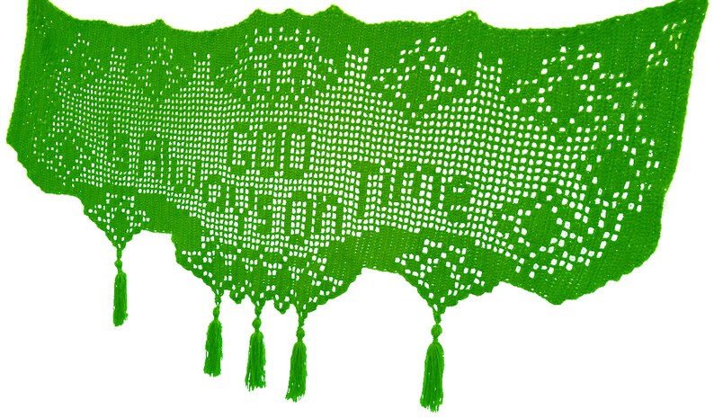May include: Bright green crocheted shawl with the words "Good Days on Time" visible. The shawl has a scalloped edge and decorative tassels hanging from the bottom. The open weave design is visible throughout the shawl.