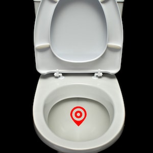 May include: A white toilet bowl with the lid up and a red location pin icon in the bowl.