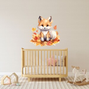May include: A watercolor illustration of a cute fox sitting on a bed of autumn leaves. The fox is orange and white with a fluffy tail. The leaves are in shades of orange, yellow, and red.