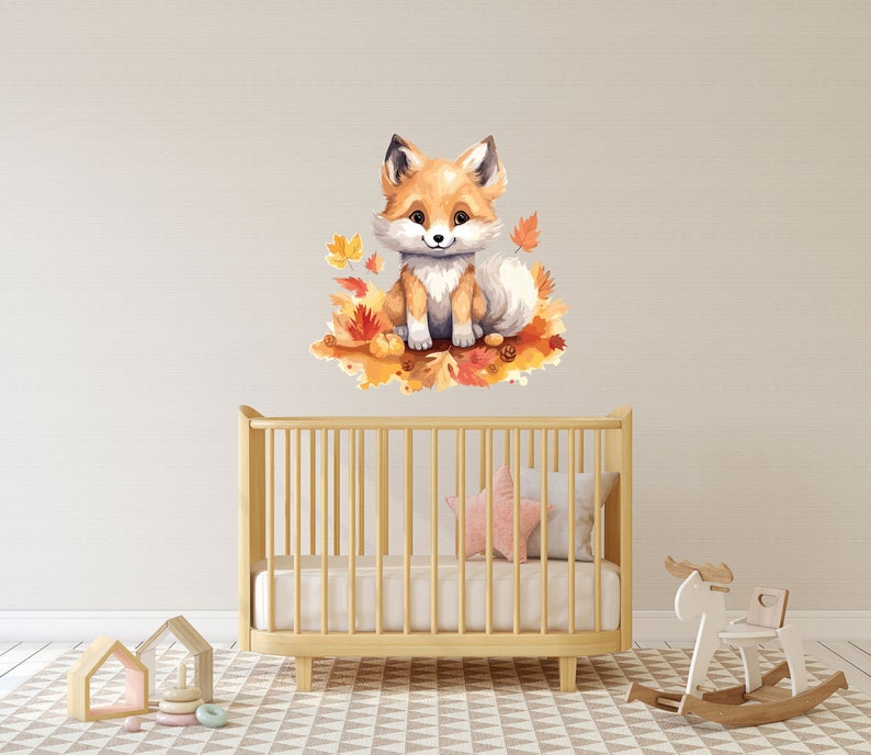 May include: A watercolor illustration of a cute fox sitting on a bed of autumn leaves. The fox is orange and white with a fluffy tail. The leaves are in shades of orange, yellow, and red.