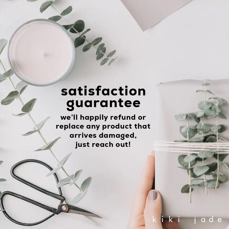May include: A white gift box with a string bow, held by a hand. The box is surrounded by eucalyptus leaves. The text "satisfaction guarantee" is written in black text, followed by "we'll happily refund or replace any product that arrives damaged, just reach out!" The text "kiki jade" is written in black text at the bottom of the image.