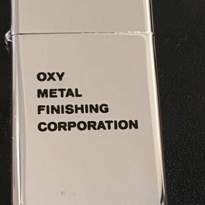 NOS OXY Metal Finishing Corporation Zippo Slim Lighter - 1971