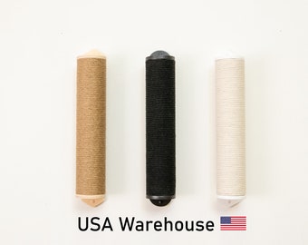 May include: Three cylindrical cat scratching posts arranged vertically, featuring a tan, a black, and a white rope-wrapped surface, each with matching end caps. Below the posts, the text reads USA Warehouse with a small American flag icon.