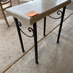 Iron and travertine table