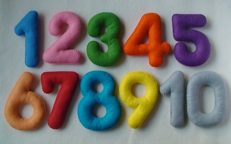 May include: Ten felt numbers, each a different colour, from 1 to 10. The numbers are sewn with a white thread.