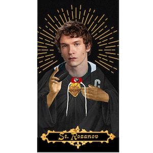 May include: Digital art piece featuring a young man in a black robe with gold accents, a halo, and a heart-shaped pendant. He holds a black computer mouse. The text "St. Rozanov" is at the bottom.
